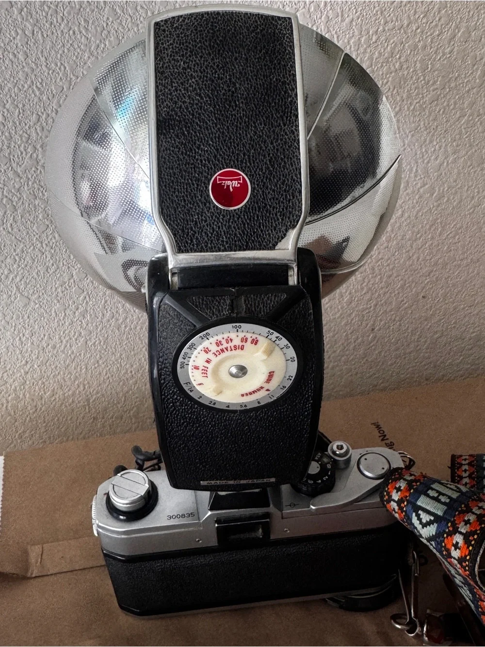 Canon Film Camera with Blue Flash Reflector and Patterned Orange-Accent Strap